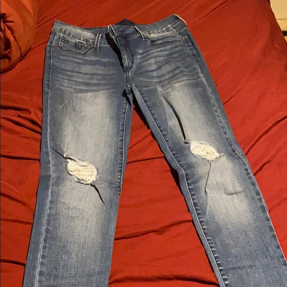 Women’s blue jeans with holes